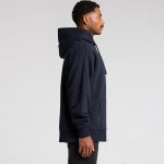 A navy blue heavy hoodie featuring a kangaroo pocket and an adjustable hood, displayed on a model from the side.