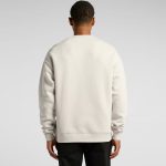 A light grey sweater with a relaxed fit, featuring a plain back and long sleeves. It has a small logo on the back.