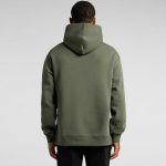 A green hoodie with a large hood, featuring a simple design and a relaxed fit, shown from the back.