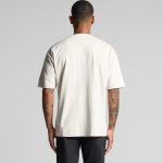 A heavy baseball jersey in cream colour, featuring short sleeves and a plain design. It has a logo on the front.