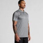 A grey polo shirt designed for workwear, featuring a collar and short sleeves, with a logo on the chest.