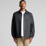 A black coach jacket with a front snap closure and a relaxed fit, featuring a logo on the chest.