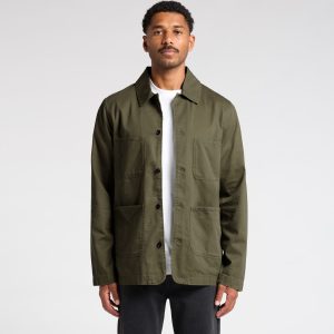 An olive green chore jacket with multiple pockets, featuring a collared neckline and button-up front. It has a logo.