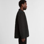 A black quilted puffer jacket viewed from the side, featuring a button-down front and a subtle logo.