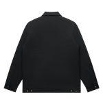 A black canvas heavy jacket featuring a collar and button detailing on the cuffs and hem, with a logo on the back.