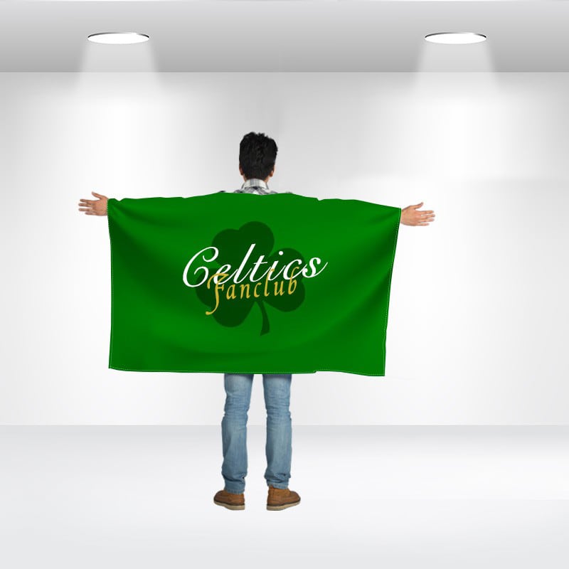 A person wearing a large green flag with a logo and text on the back, standing in a well-lit space. Body Flag - Image 1
