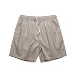 Beige beach shorts with an elastic waistband and white drawstring. Features a logo on the waistband.
