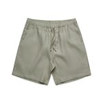 Linen dress shorts in a muted green shade, featuring an elastic waistband and drawstring.