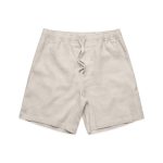 Linen shorts in a light beige colour with an elastic waistband and drawstring. Features side pockets.