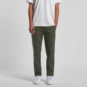 Straight pants in olive green, featuring a relaxed fit and front pockets, paired with a plain white t-shirt and white shoes.