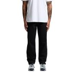 Black relaxed pants worn by a person standing, paired with a plain white t-shirt and athletic shoes.