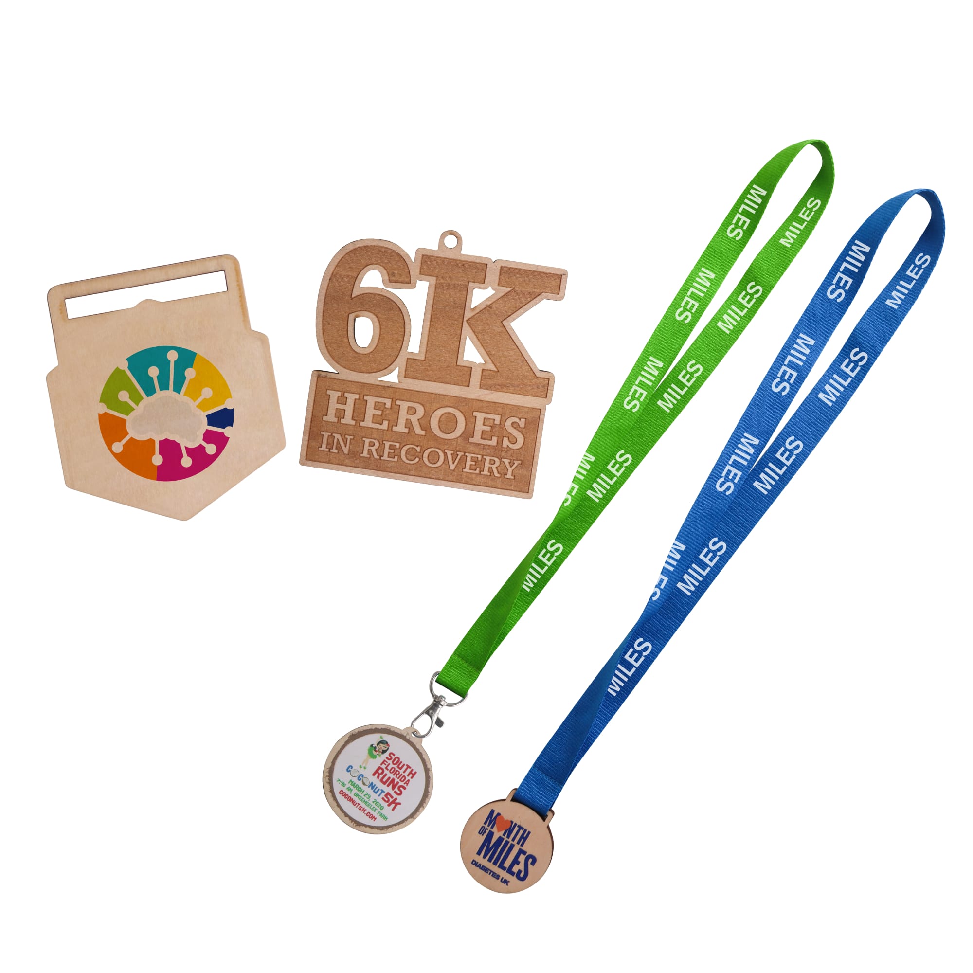 Custom-shaped wooden medals in natural wood tones, with colourful lanyards in green and blue. Includes a logo. Custom Shaped Wooden Medal with Bamboo Lanyard - Image 1