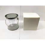 A large clear PVC bucket with a metal handle, next to a plain white box, suitable for packaging.