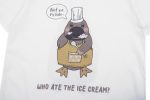 A white cotton t-shirt featuring a cartoon platypus wearing a chef's hat and apron, with the text "Who ate the ice cream?"