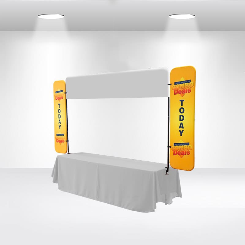 A table top banner with yellow side panels and a blank central area, set up in a bright indoor space. Table Top Banner -Side Panel - Image 1