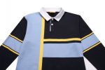 A sports jumper featuring black, blue, and yellow stripes, with a white collar and a logo.