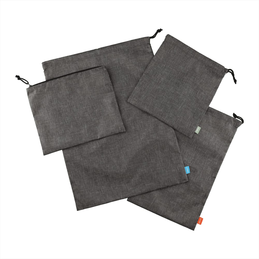 A set of four grey recycled clean bags featuring drawstring closures and a variety of sizes. Excursion Recycled Clean Bags Set - Image 1