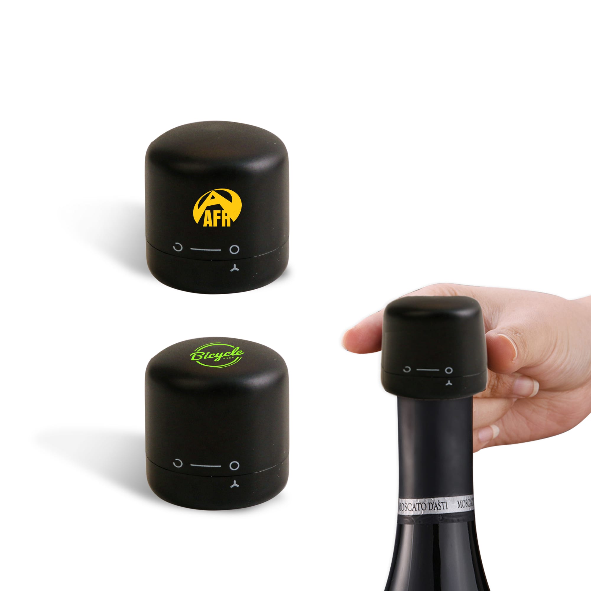 A drink bottle stopper set in black, featuring two designs, one with a logo and one plain, being placed on a bottle. Bottle Stopper - Wine - Image 1