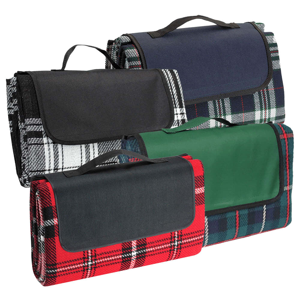 A selection of picnic rugs in navy, green, red, and black plaid, each featuring a carrying handle. Picnic Rug - Image 1
