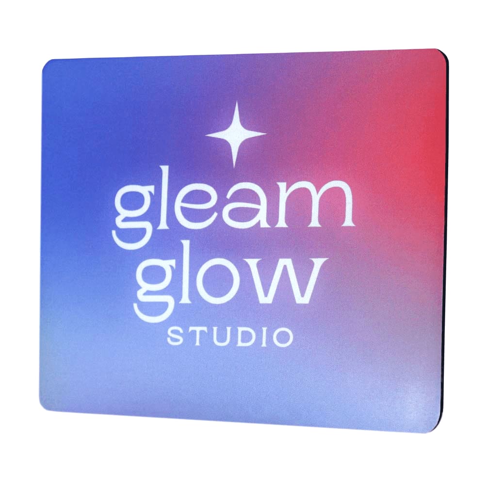 A mouse pad features a gradient design in purple and red, displaying a logo. Mousemate Mouse Pad - Image 1