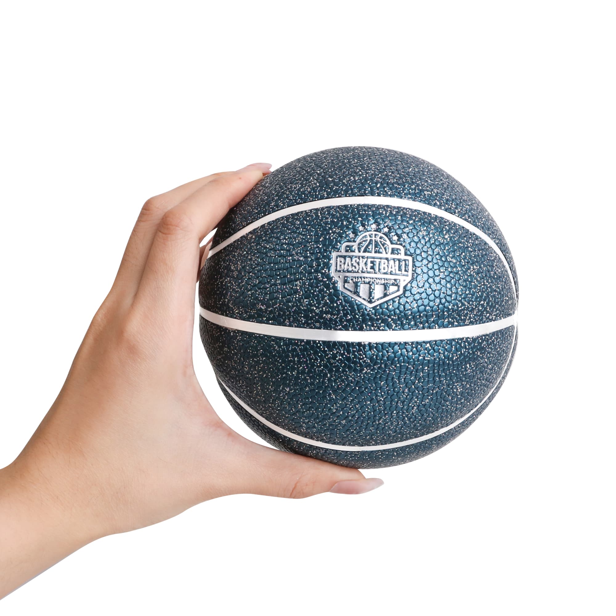 A hand holds a dark blue mini basketball with a textured surface and white lines, featuring a logo. Mini Basketball - Image 1