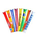 A set of colourful inflatable bang sticks in red, yellow, blue, and white, featuring various logos and designs.