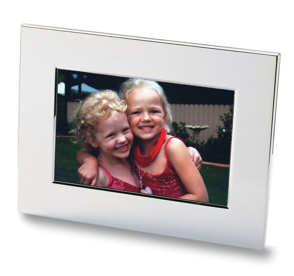 A nickel-plated photo frame featuring a vibrant image of two smiling girls with curly hair. Nickel Plated Photo Frame - Image 1