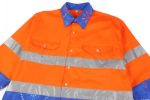 A vibrant orange Hawaiian shirt with reflective silver stripes and a blue patterned collar, featuring a logo.