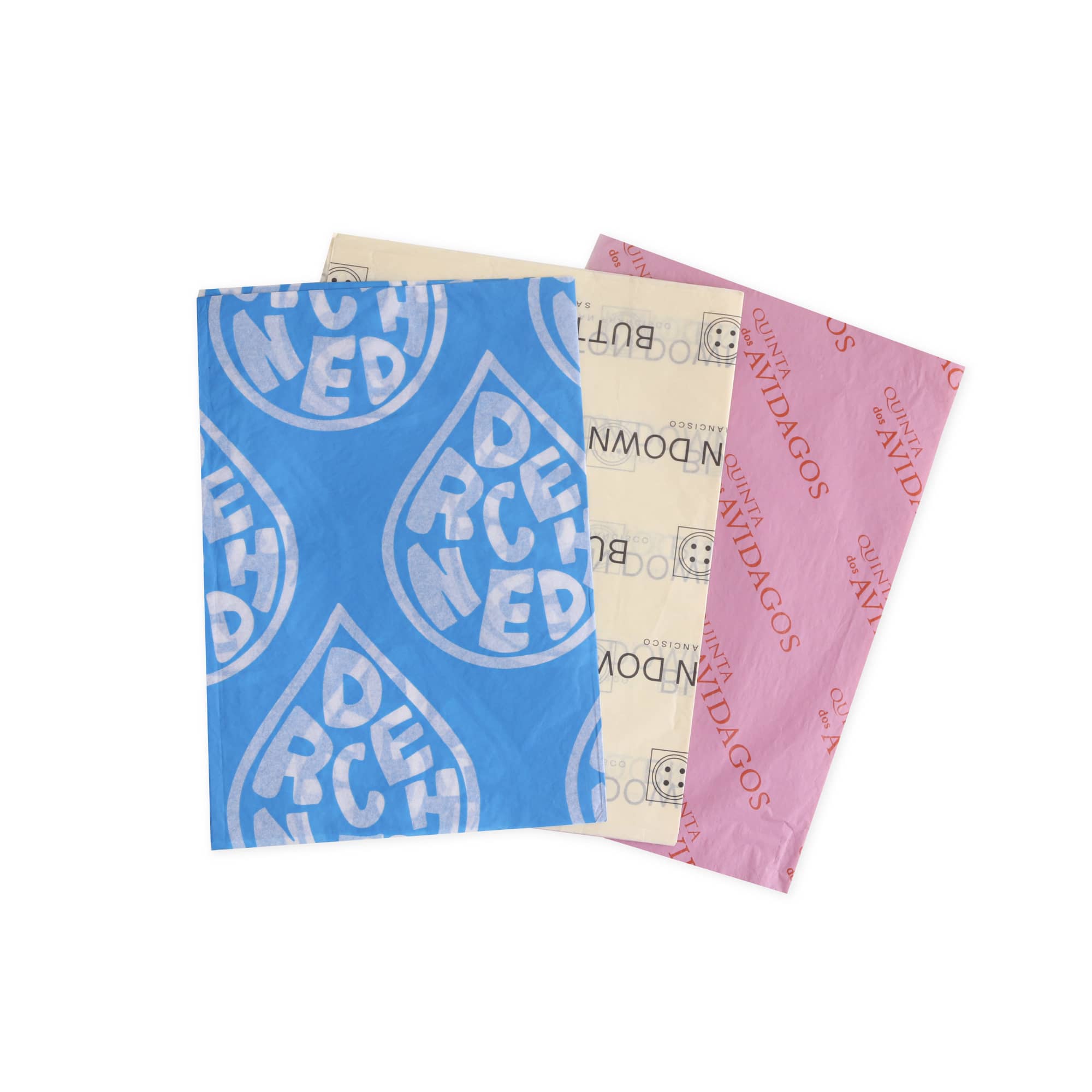 A stack of Kraft paper sheets in blue, cream, and pink, featuring various patterns and a logo. Kraft Paper (38x50cm) - Image 1