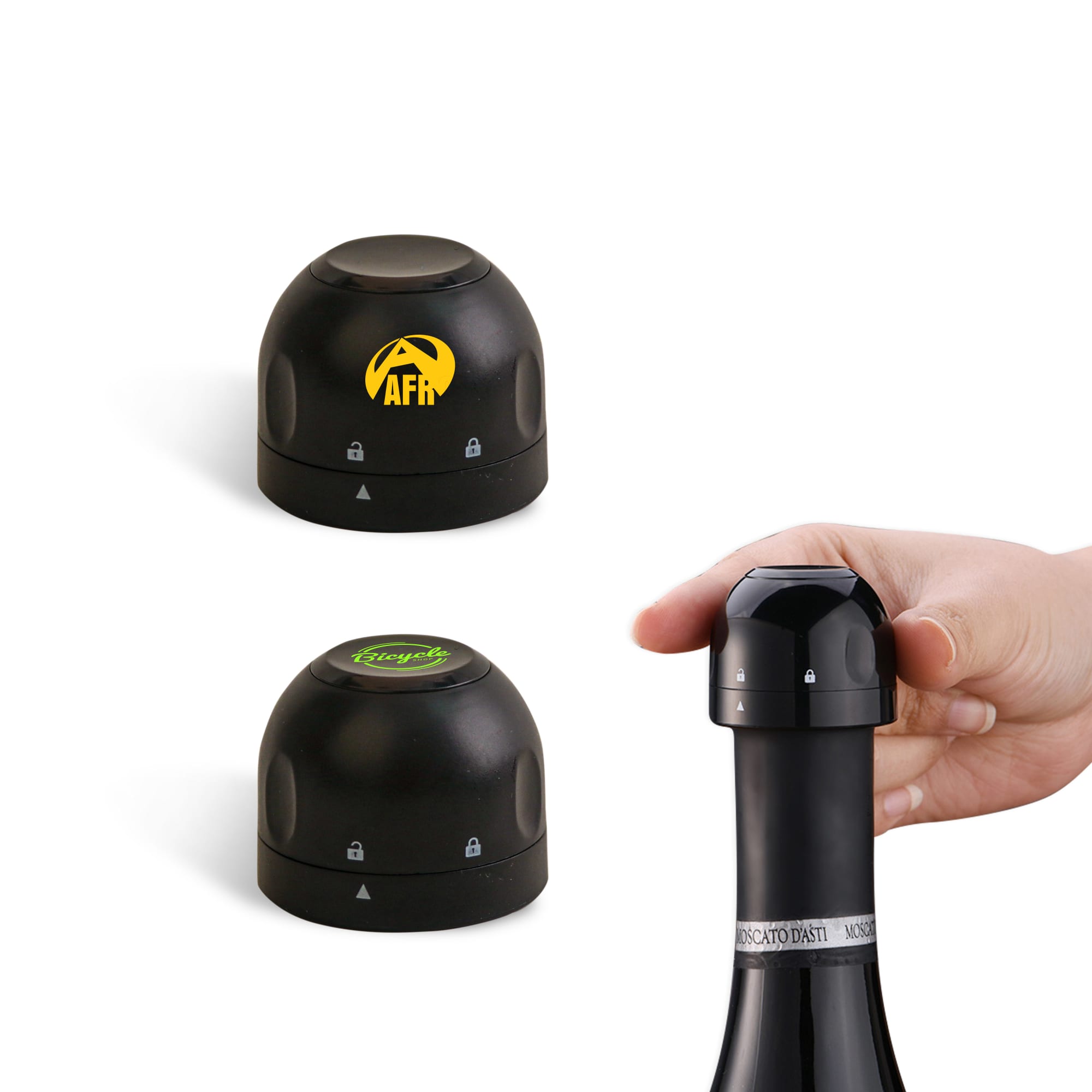 A drink bottle stopper in black, with two interchangeable tops and a hand holding one, featuring a logo. Bottle Stopper - Champagne - Image 1