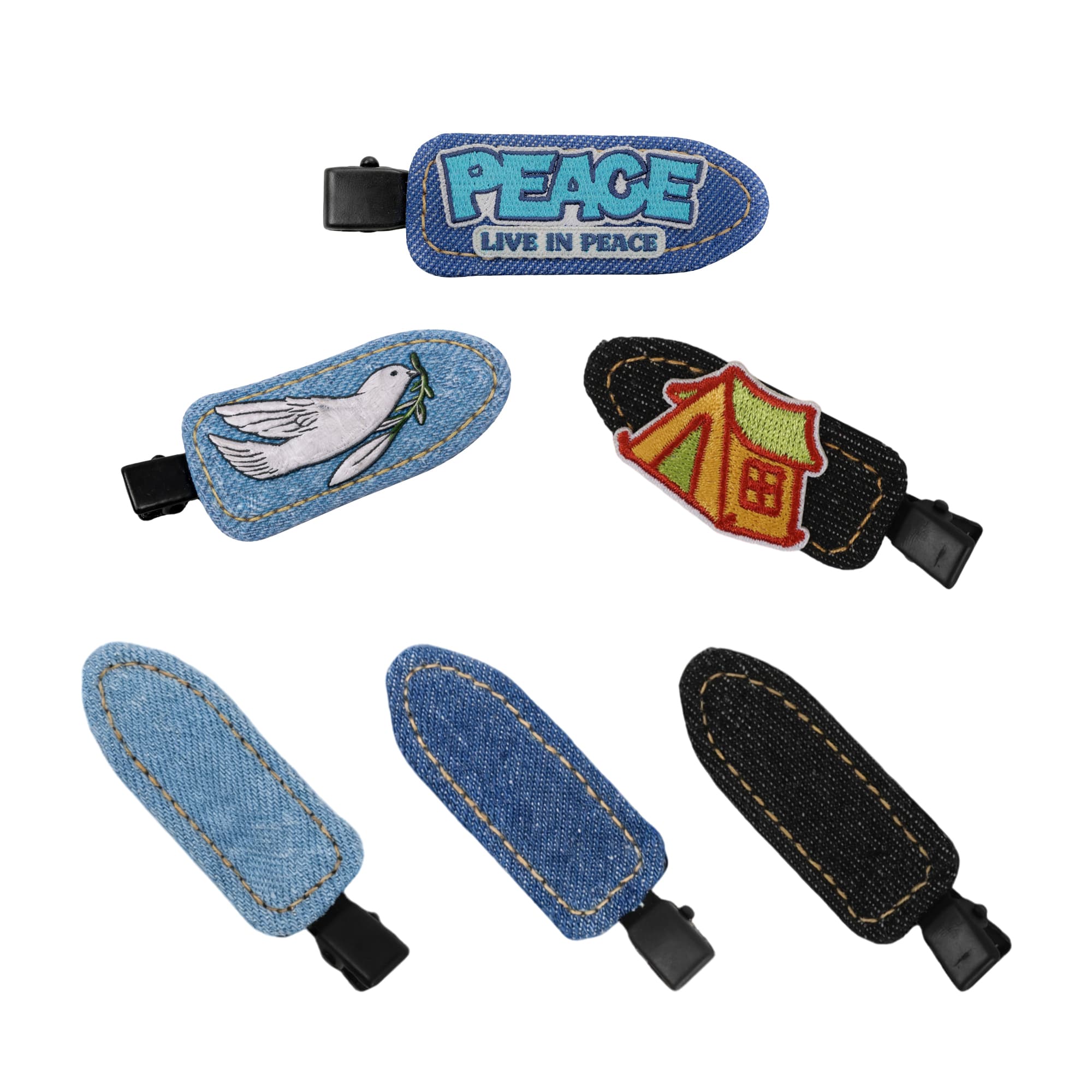 A collection of denim hair clips featuring designs like a dove and a tent, with blue and black denim finishes. Denim Duck Bill Hair Clip - Image 1