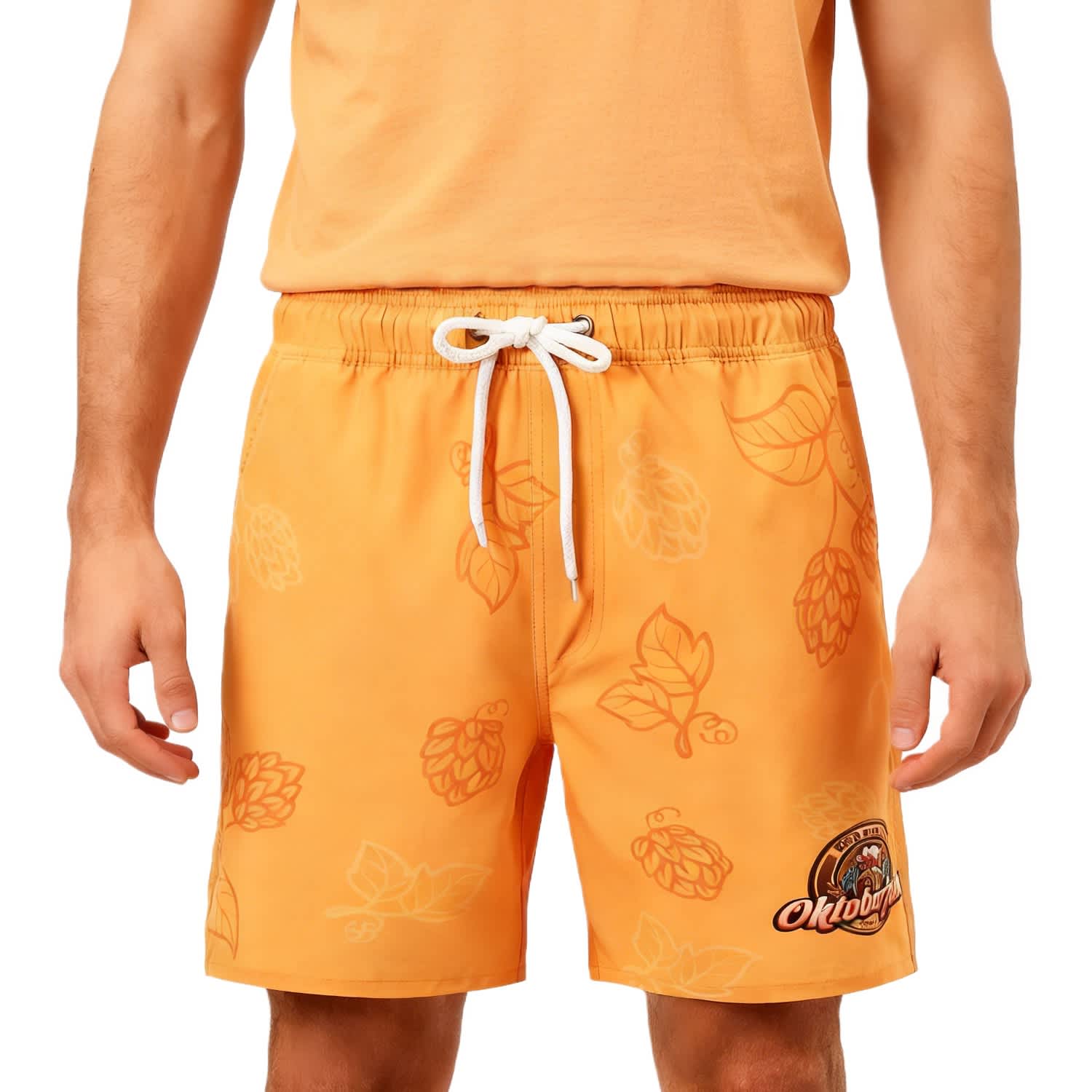 Men's orange polyester spandex swim shorts featuring a leaf pattern and a logo on the front. Men's Polyester Spandex Sublimated Swim Shorts - Image 1
