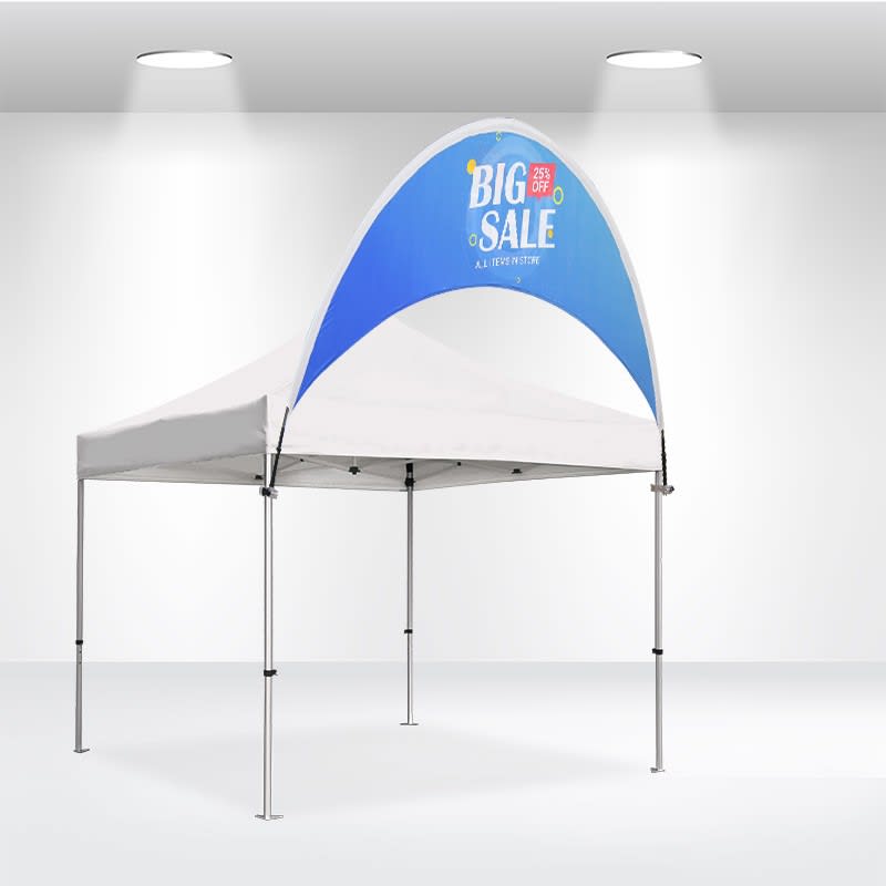 A curved tent billboard banner in blue and white, featuring a logo, set up in an indoor space with white walls. Curve Tent Billboard Banner 10x10ft - Image 1