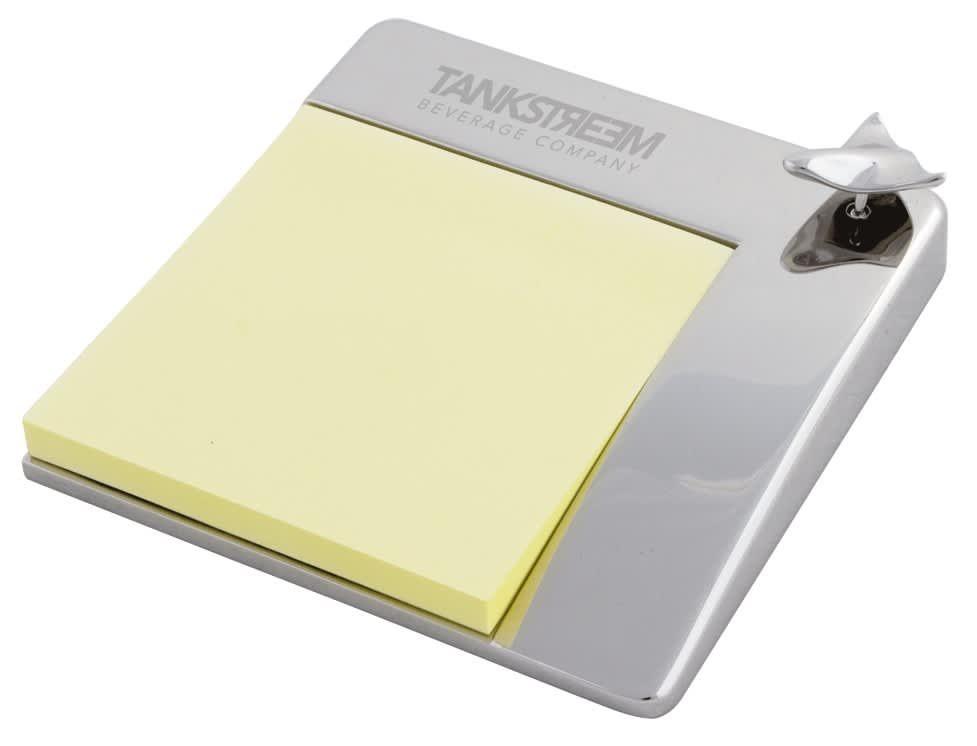 Aero Note Holder with a silver finish and a yellow sticky note pad. Features a branding logo. Aero Note Holder - Image 1