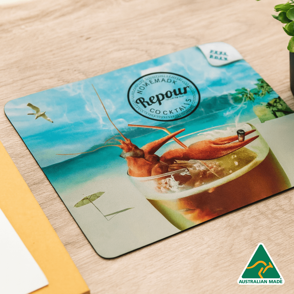 A cocktail coaster featuring a vibrant drink with shrimp, an umbrella, and a beach backdrop. Includes a logo. Ezi Gripz Coasters (95mm x 95mm) - Image 1