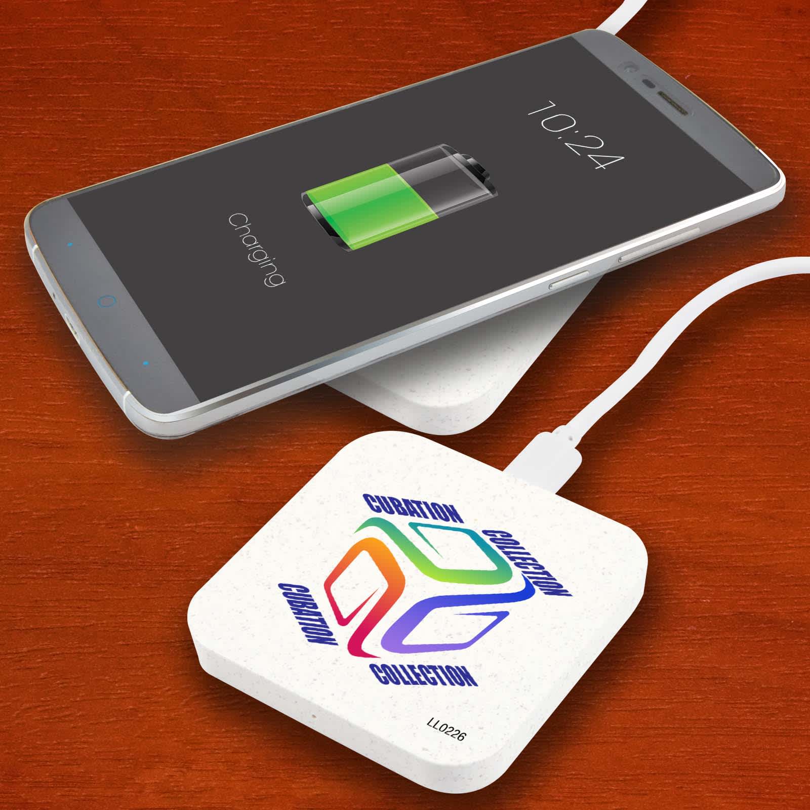A square wireless charger in white with a logo, placed beneath a smartphone displaying a charging battery icon. Arc Eco Square Wireless Charger - Image 1