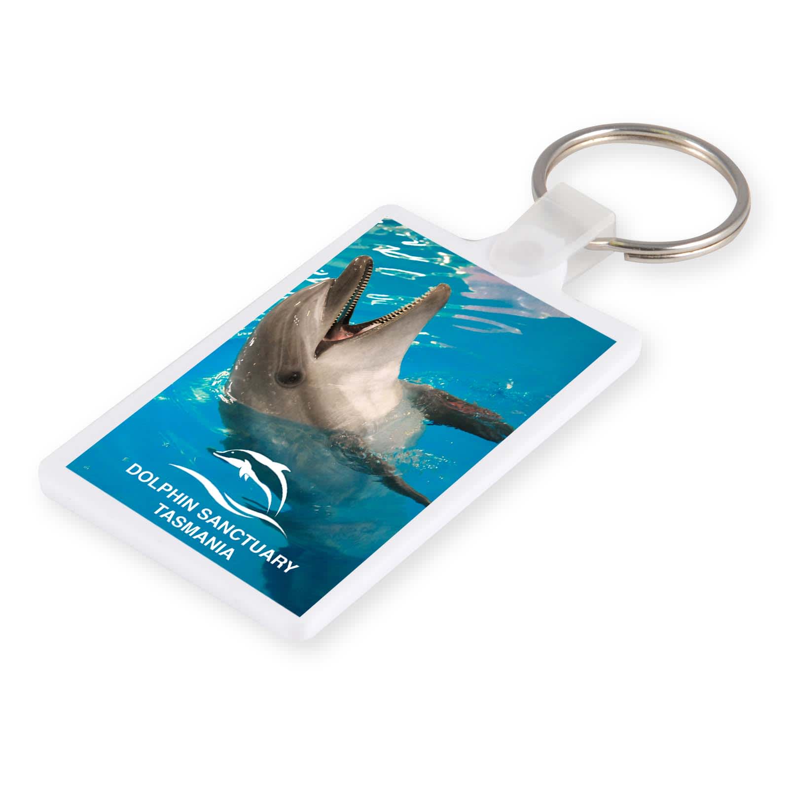 A white keytag featuring a dolphin swimming in blue water, with a logo at the bottom. Condo Keytag - Image 1