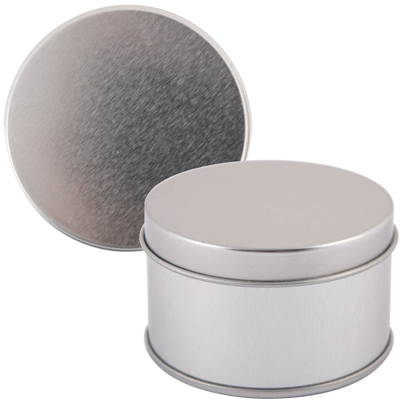 A silver round tin with a smooth finish and a removable lid, positioned upright next to its lid. Silver Round Tin - Image 1