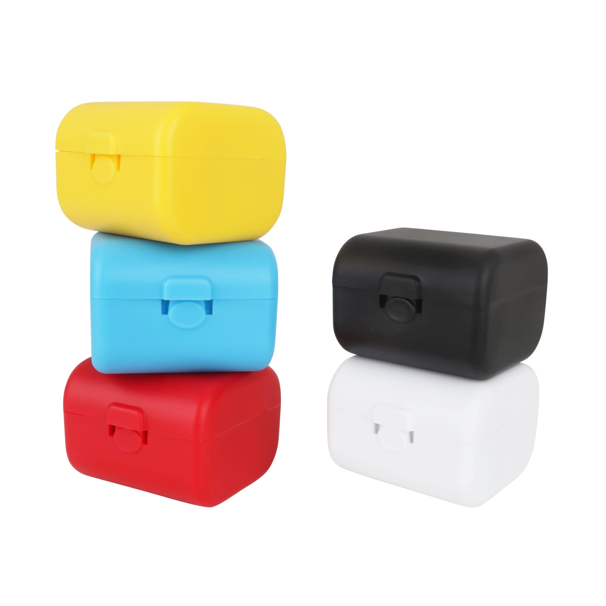 A stack of four travel adapter kits in yellow, blue, red, and black. Each kit features a clasp closure. Universal Travel Adapter Kit - Image 1