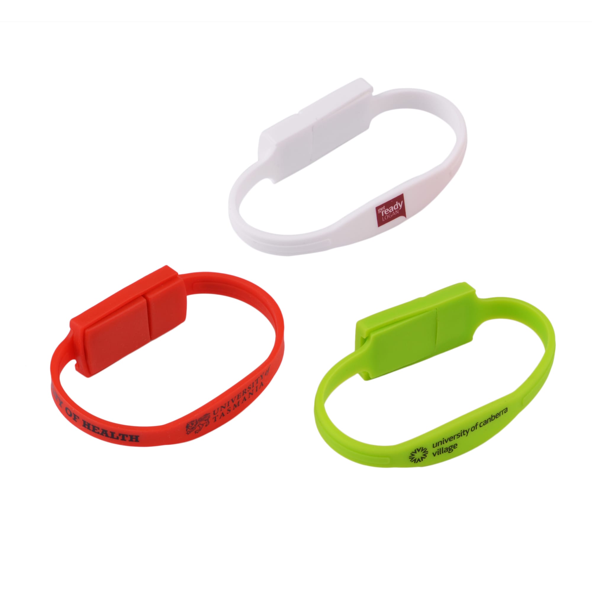 A collection of slim silicone wristband flash drives in red, white, and green, featuring various logos. Slim Silicone Wristband Flash Drive - Image 1
