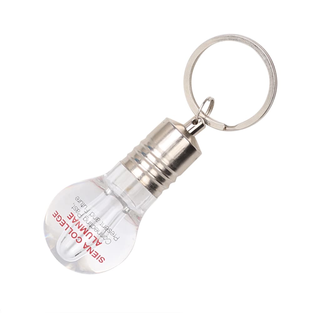 A light bulb-shaped flash drive in clear and silver, attached to a keyring. It features a small logo. Light Bulb Flash Drive - Image 1