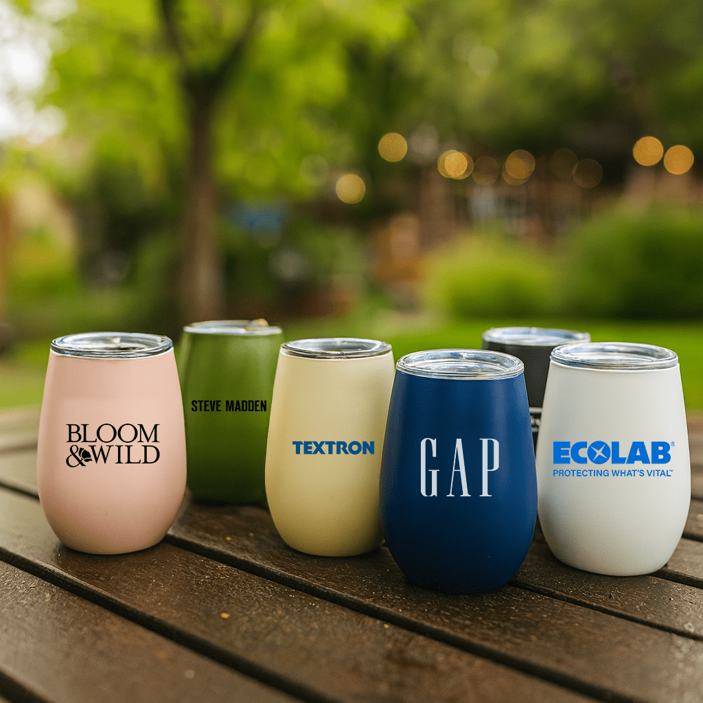 A collection of plastic cups and tumblers in various colours, featuring different logos and designs, on a wooden surface. Calm Cup (230mL) - Image 1