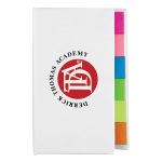 A white book with a logo on the cover and colourful sticky note tabs in pink, green, and orange.