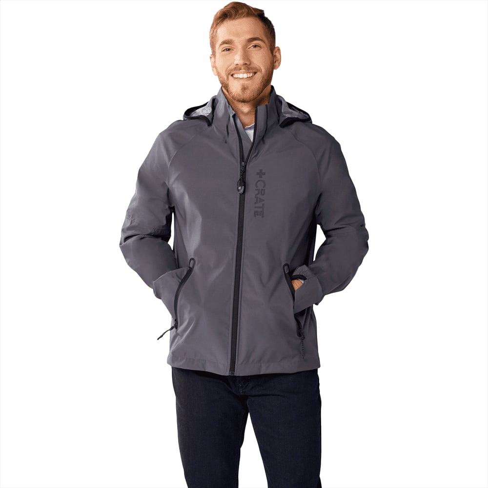 A grey softshell jacket for men featuring a hood and pockets, with a logo on the front. Oracle Softshell Jacket - Mens - Image 1