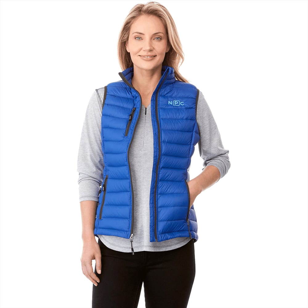 A woman models a vibrant blue down vest with a zippered front, featuring side pockets and a logo. Whistler Light Down Vest - Womens - Image 1