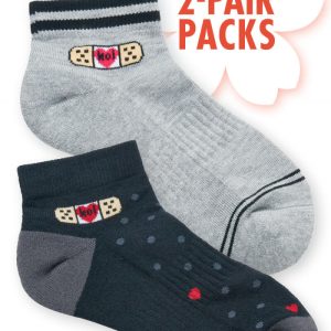 A pair of compression ankle socks, one in grey and the other in navy with polka dots, featuring a logo.