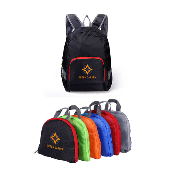 A collection of compact, foldable backpacks in black, green, orange, blue, red, and grey, each with a logo. Rhombus Compressed Bag - Image 1