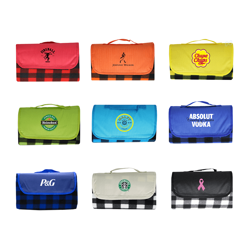A variety of picnic blankets in bright colours and patterns featuring different logos and brand designs. Pluto Picnic Blanket - Image 1