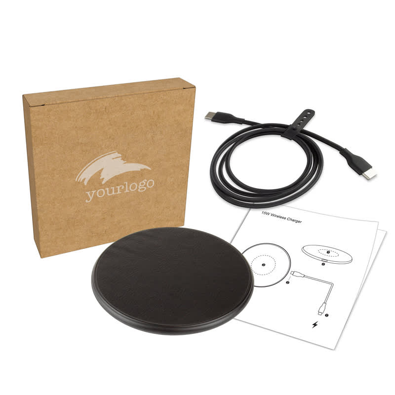 A black eco wireless charger with a USB cable, instruction manual, and a branded box. Casper Pro 15 Watt Eco Wireless Charger - Image 1