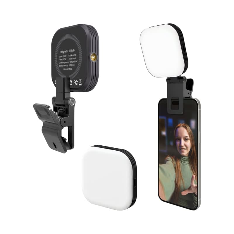 A magnetic LED selfie light in black and white, designed to attach to a smartphone for improved lighting. Essex Magnetic LED Selfie Light - Image 1
